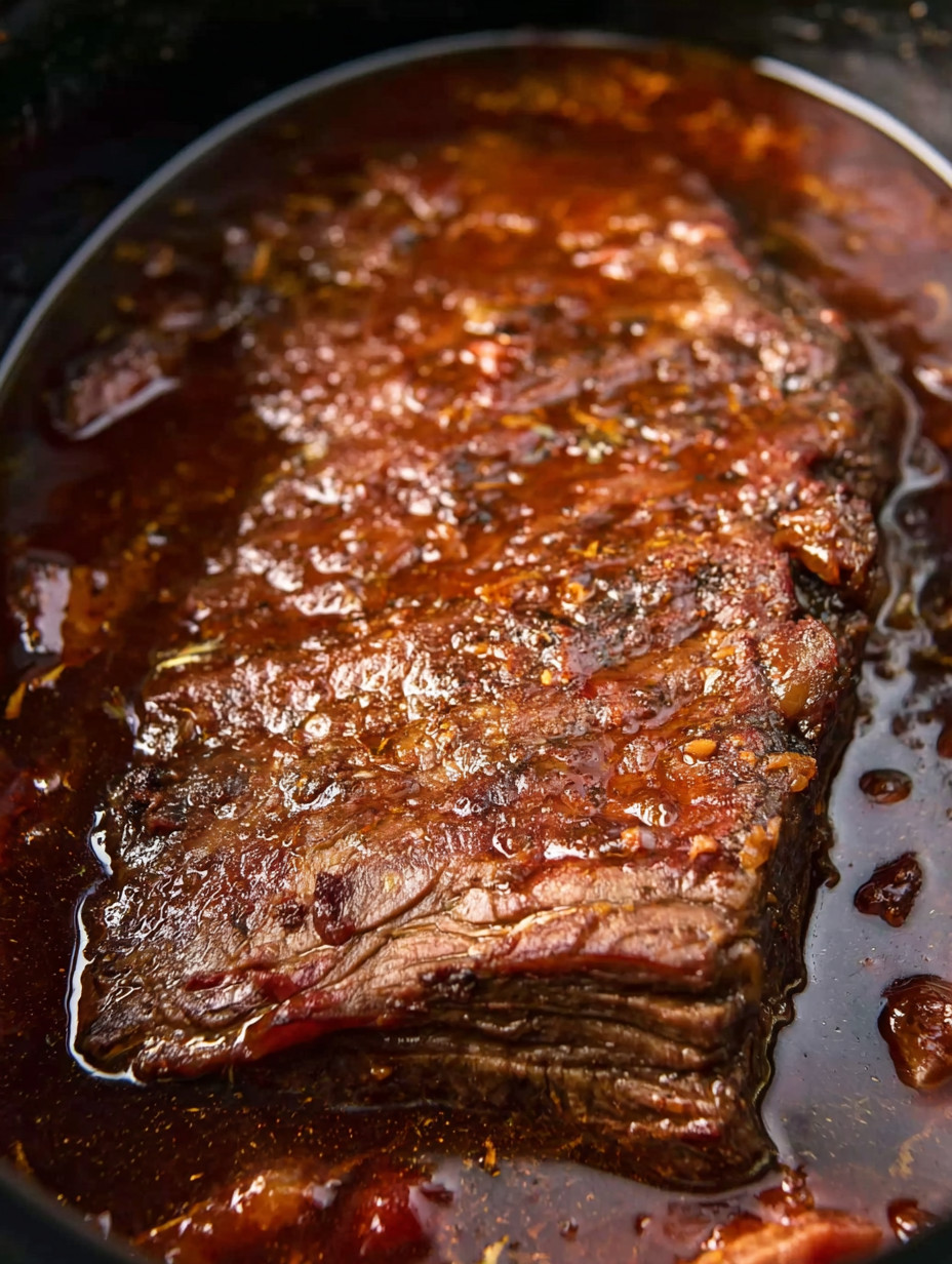 A piece of meat in a bowl.