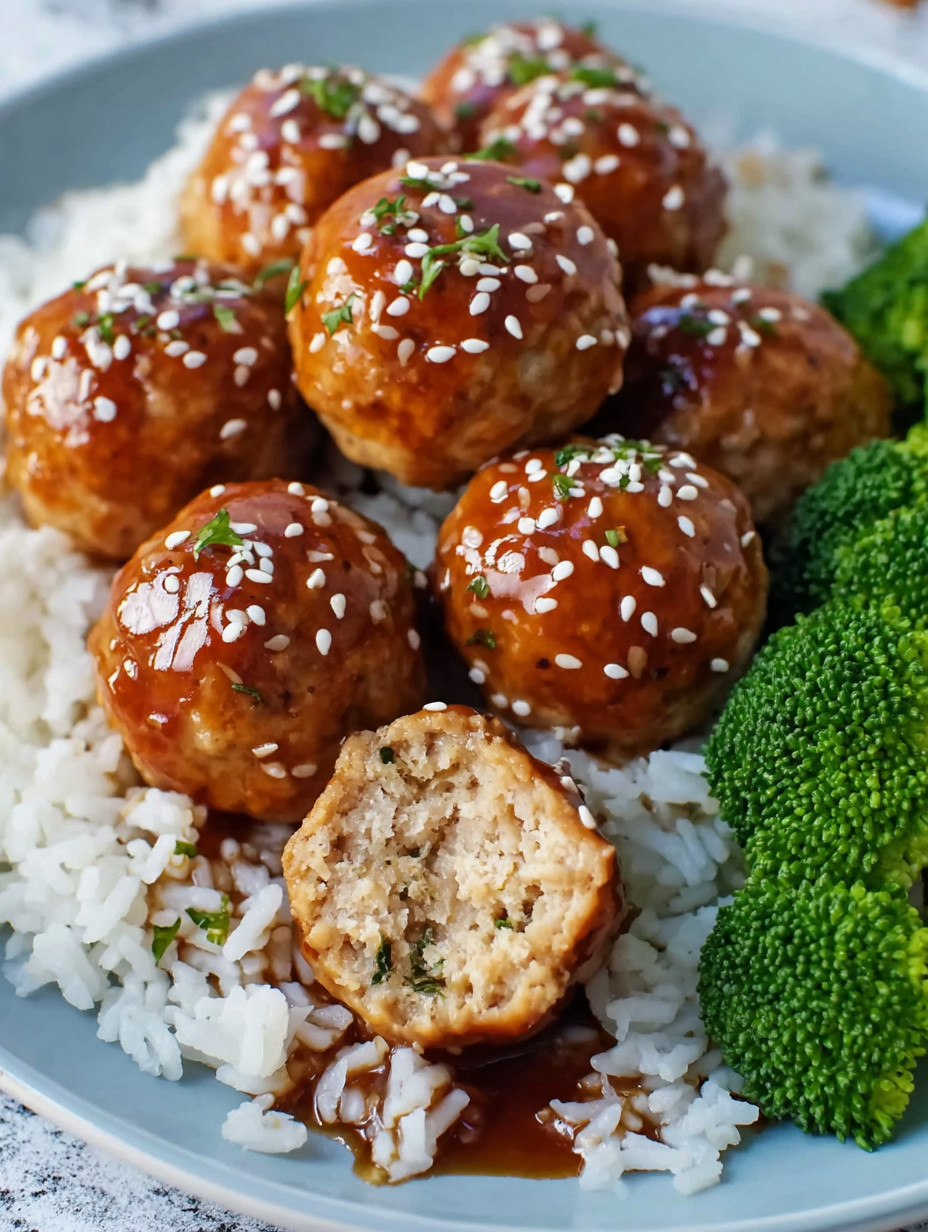 A plate of meatballs and rice.