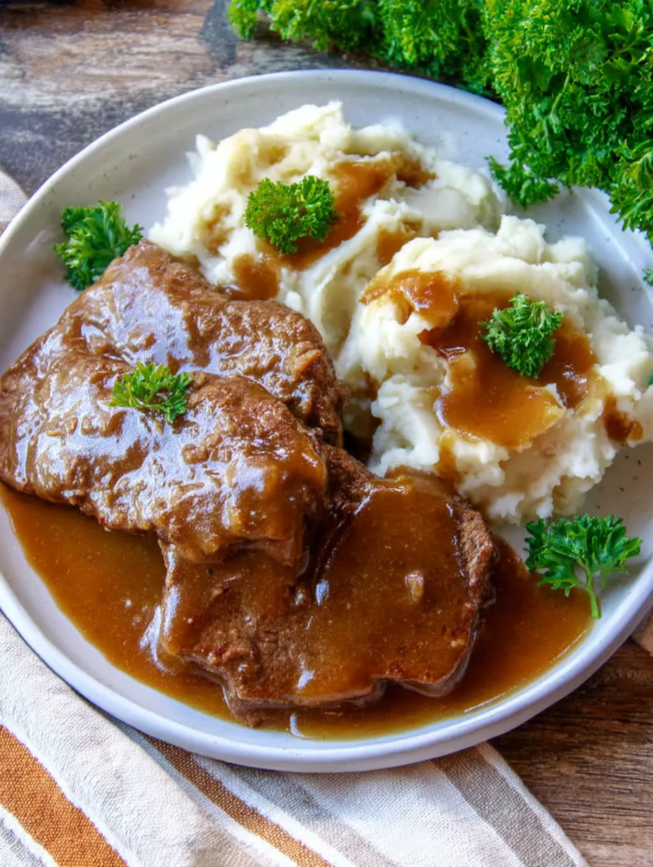 A plate of meat and potatoes.