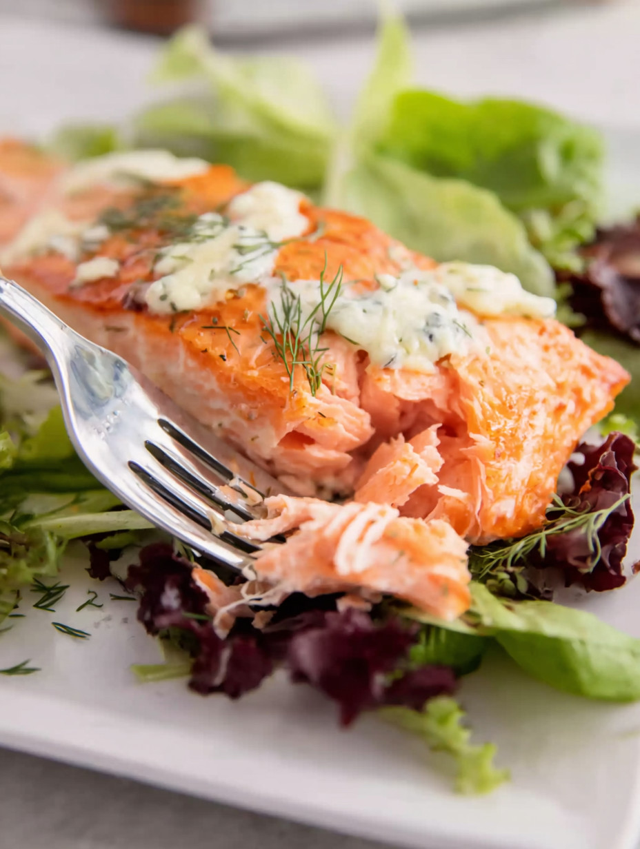 A fork with salmon on it.